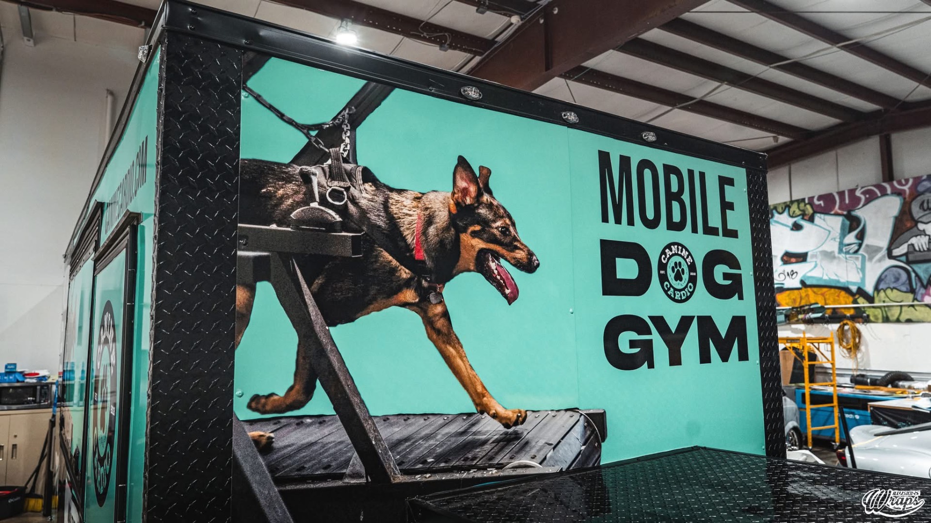 Mobile Dog Gym trailer — dog running on a treadmill graphic