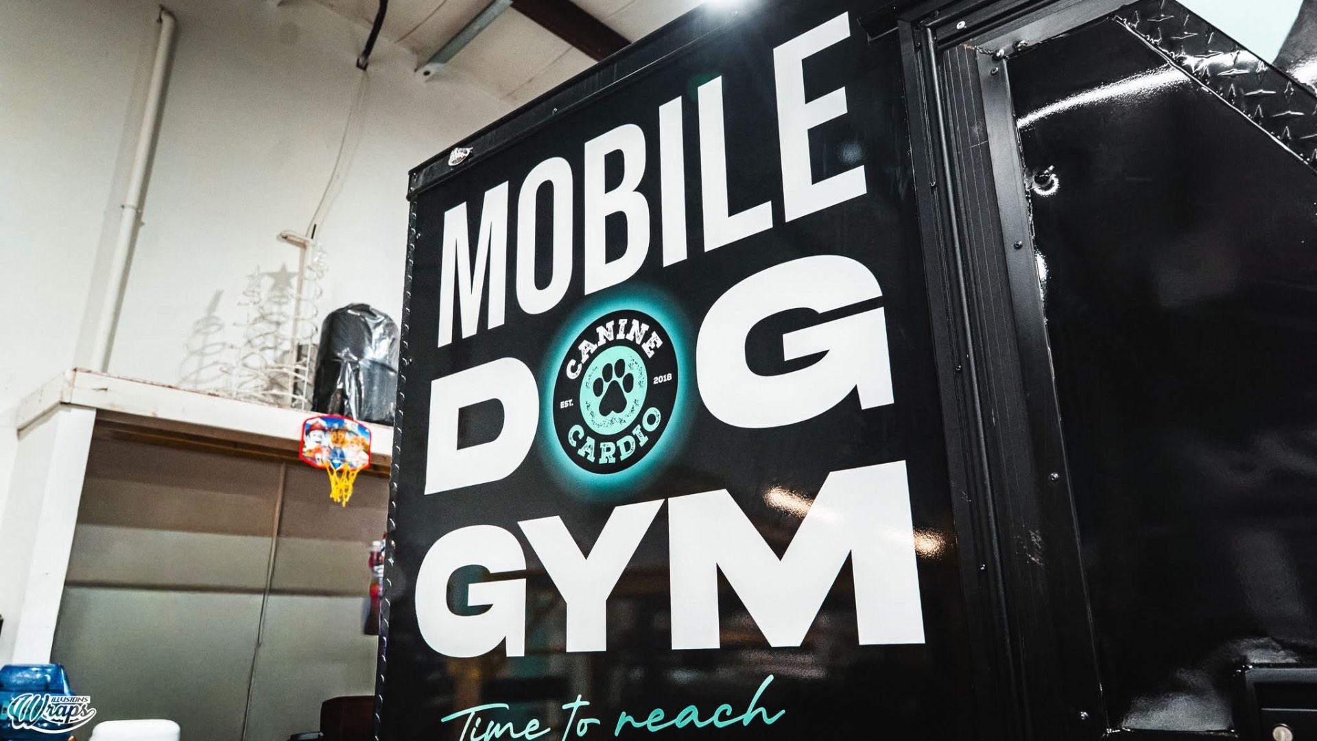 Mobile Dog Gym trailer — Canine Cardio logo panel