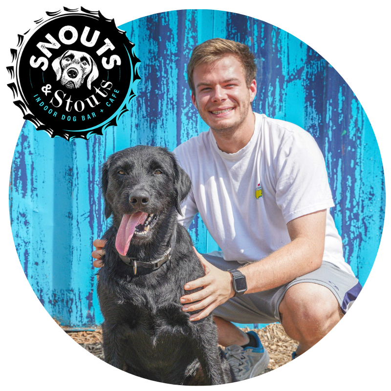 Daniel Ramos, co-owner of Canine Cardio, with a black lab