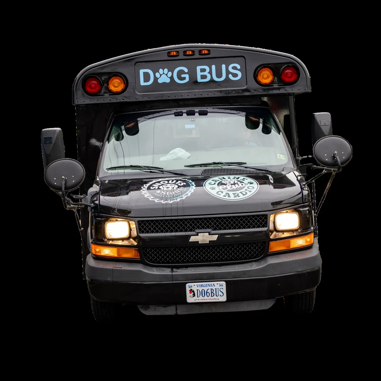 Front view of the Canine Cardio Dog Bus with headlights on