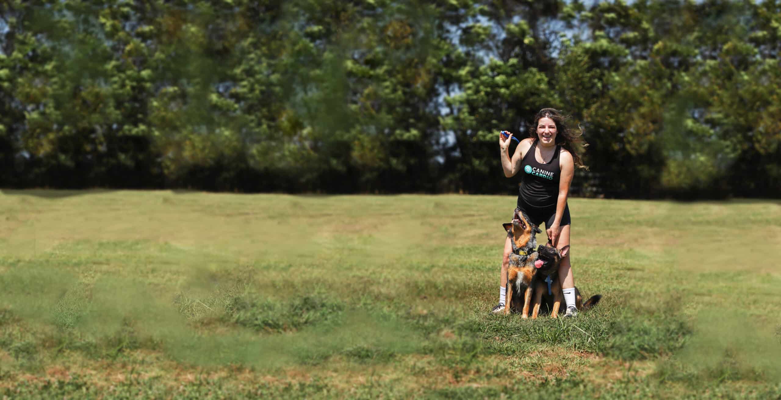 Brittany Schneller working with dogs on a field trip